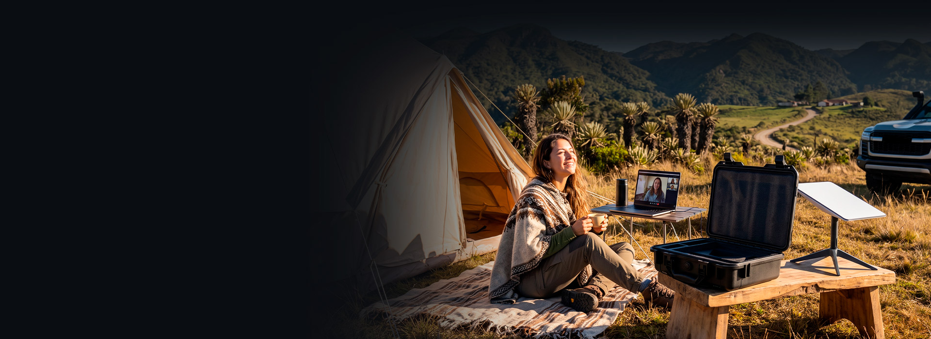 Traveler connected with Starlink Mini® next to her tent and the Nexxt Anywhere rugged travel case
