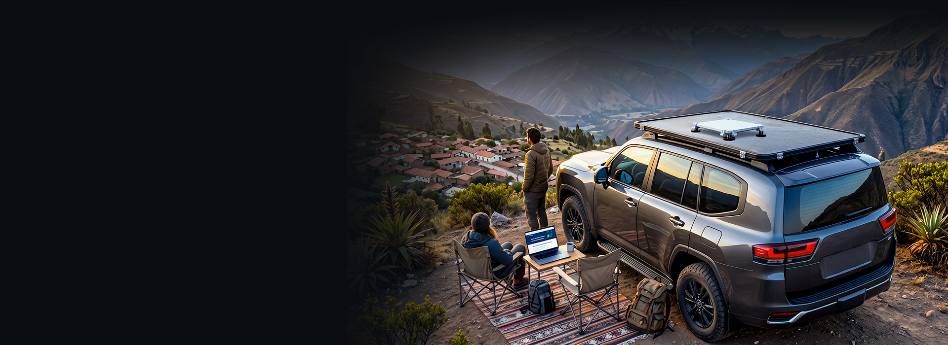 Travelers connected next to their SUV with a Starlink Mini® on the roof, overlooking a mountain valley